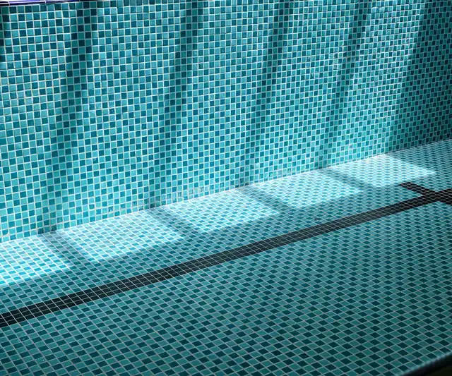 Sunlight on the tiles of the pool
