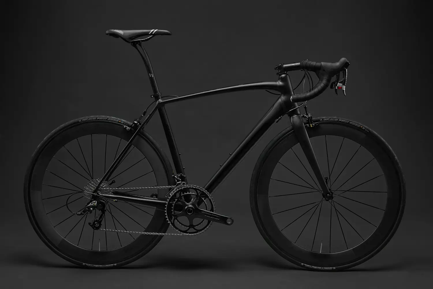 A black road bike in the studio